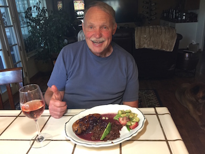 mad giving thumbs up while eating mole red rice