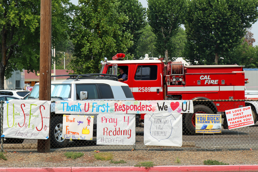 fire truck and signs of supports for first responders