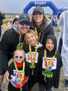 family portrait after race with medals