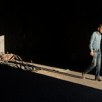 rice farmer walking in barn